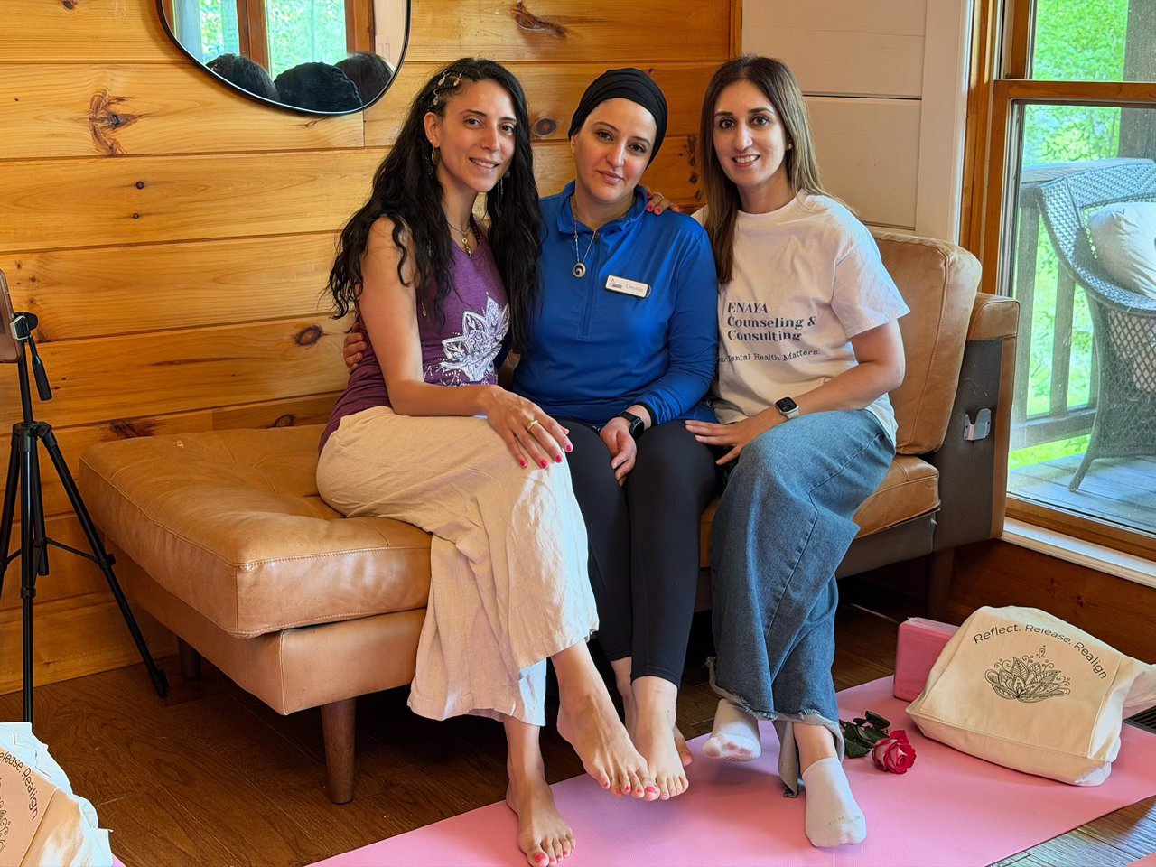 Three women together on a couch at the retreat