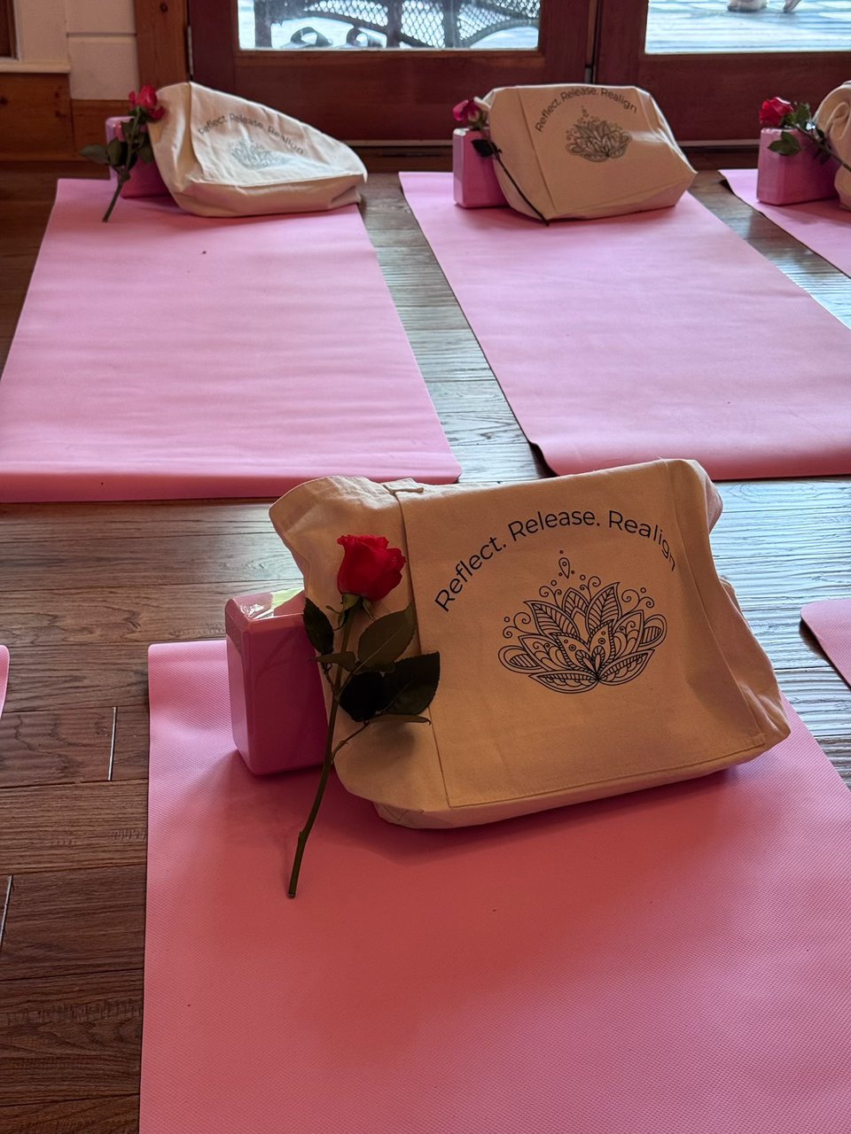 Reflect Release Realign tote with a red rose